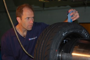 spring Dave Kaemmer takes measurements of a racing tire for research purposes